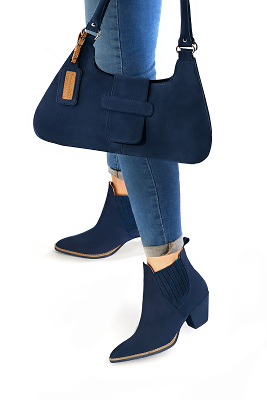 Navy blue women's ankle boots, with elastics. Tapered toe. Medium cone heels. Worn view - Florence KOOIJMAN